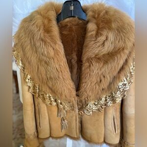 Vintage lamb shearling with tan/camel suede accented with distinctive gold lace.